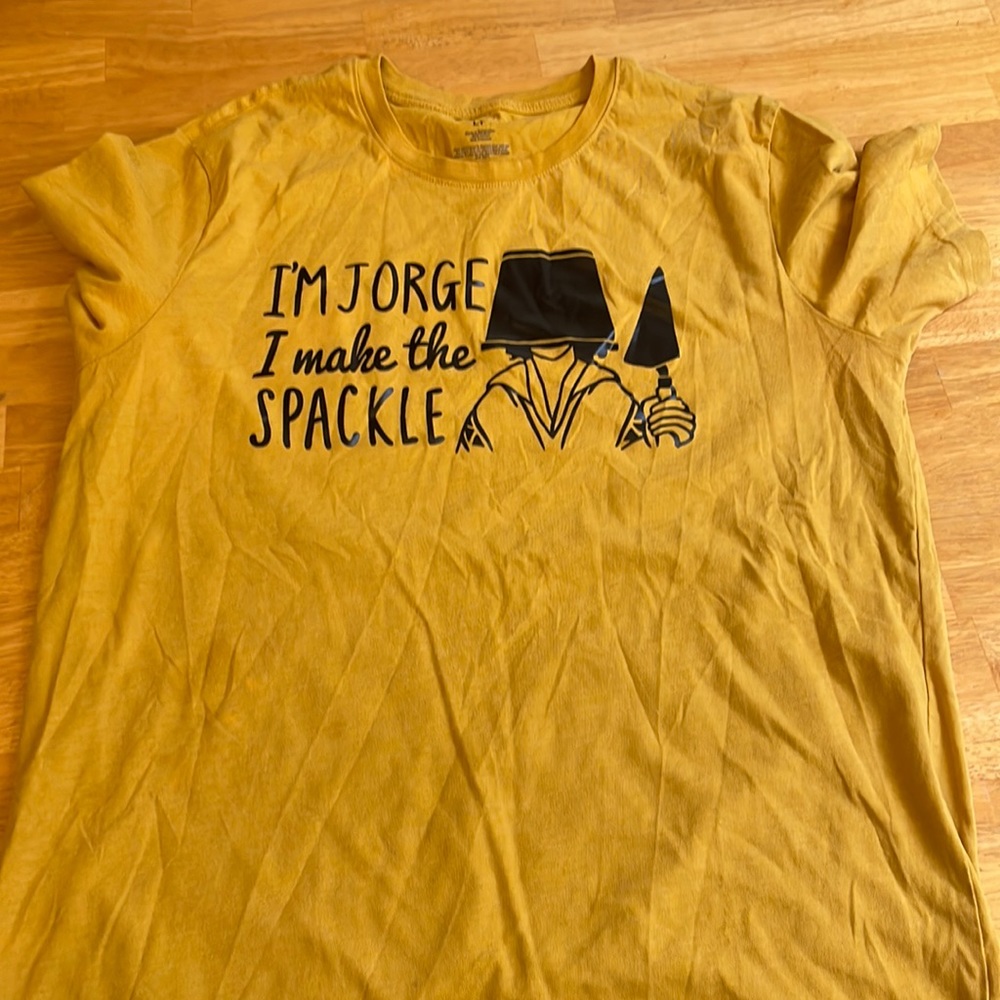 Large yellow, graphic tee.